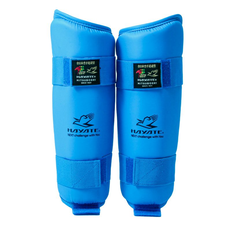 Pair of blue shin guards with Hayate branding on a white background