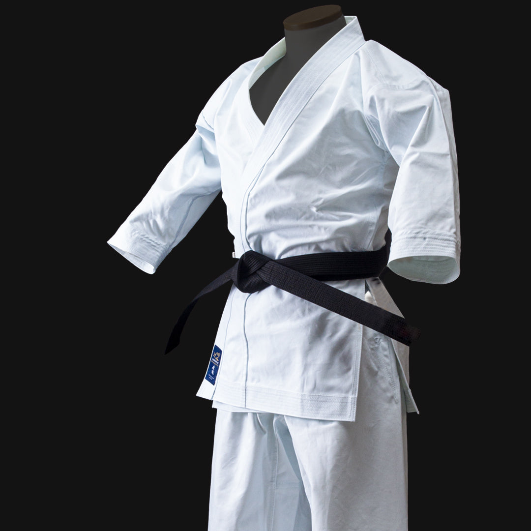 White Hayate martial arts uniform with a black belt on a black background