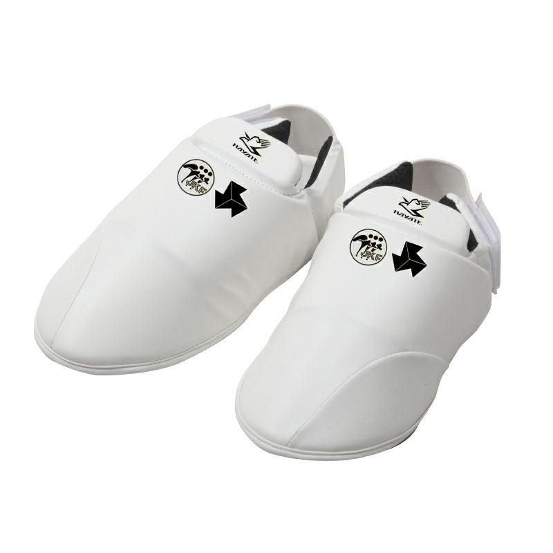 Pair of white martial arts instep protectors with black logos on a white background